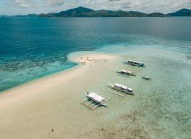 Aerial shot of the boats on the calm crystal clear ocean Aerial shot of the boats on the calm crystal clear ocean