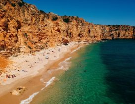 Beautiful view of a sandy beach under the cliff