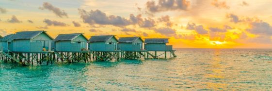 Beautiful water villas in tropical Maldives island at the sunset Beautiful water villas in tropical Maldives island at the sunset